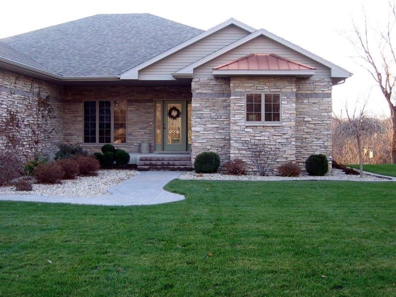 A house with a wreath on the front door