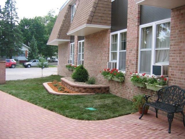A brick building with a bench in front of it