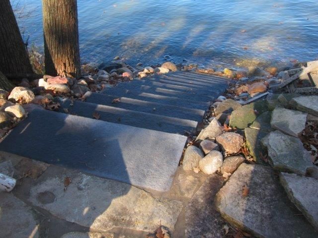 A set of stairs leading to a body of water