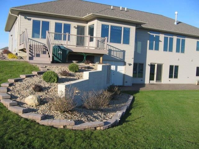 A large house with a large lawn in front of it