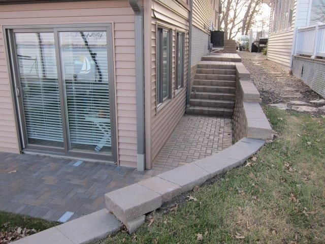 A house with a patio and stairs leading up to it