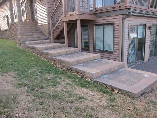 A row of concrete steps leading up to a house.