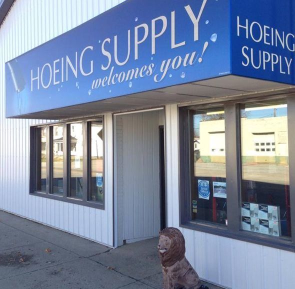 A blue sign for hoering supply welcomes you