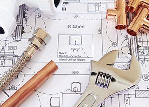 Plumbing Tools Arranged On House Plans