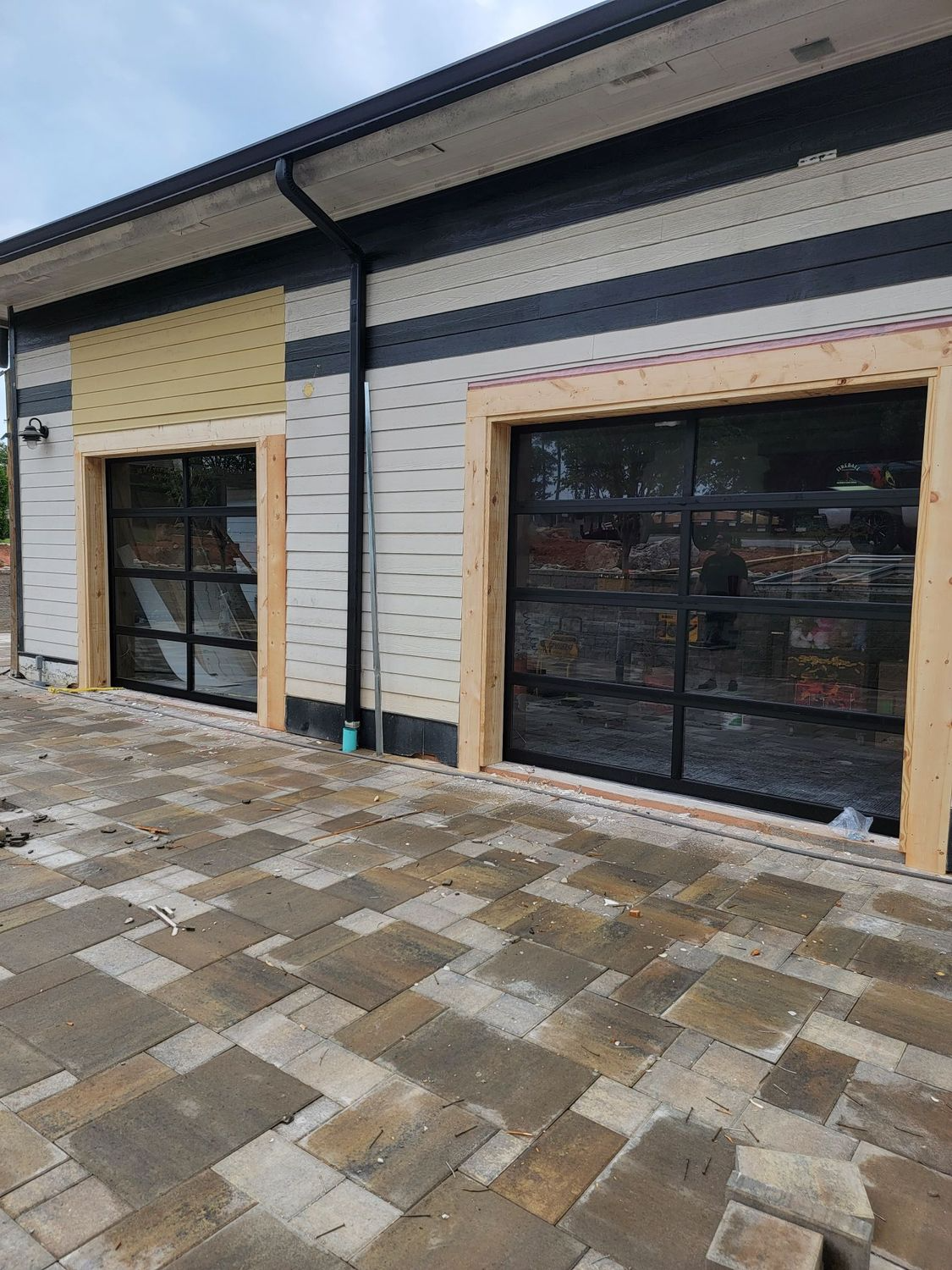 A building with a lot of windows and a patio in front of it.