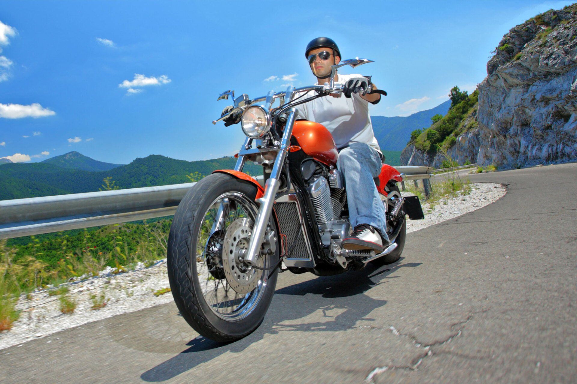 Man riding a chopper motorcycle