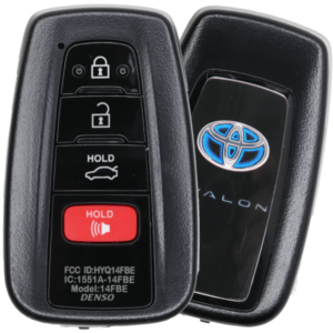 A toyota key fob with a red hold button