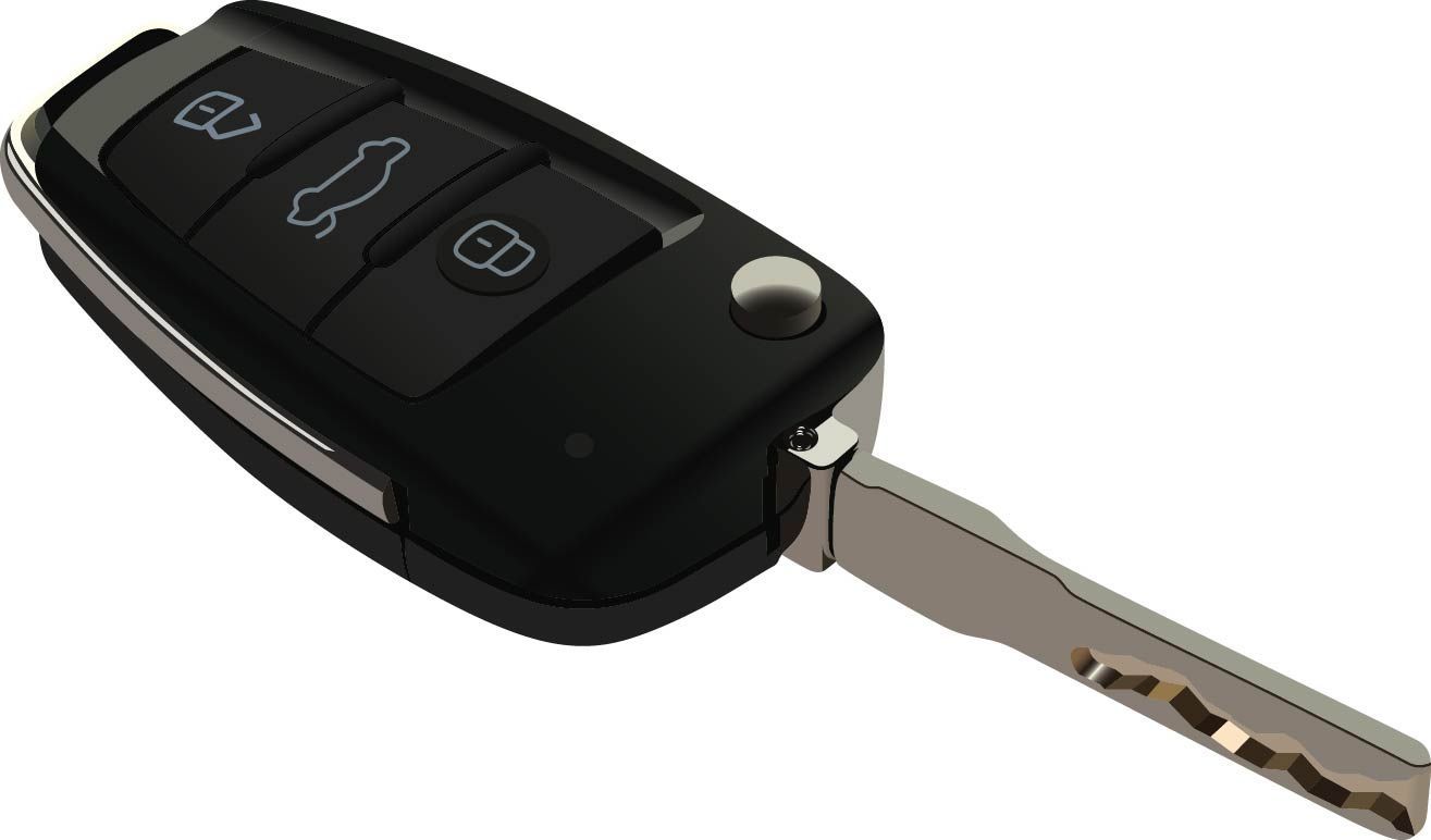 A close up of a car key on a white background
