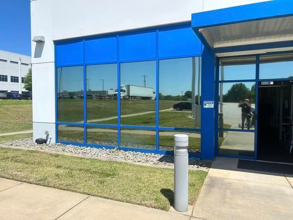 A blue and white building with a lot of windows