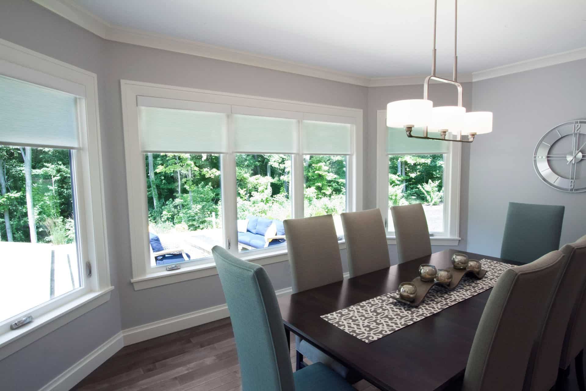 a dining room with a table and chairs and a chandelier