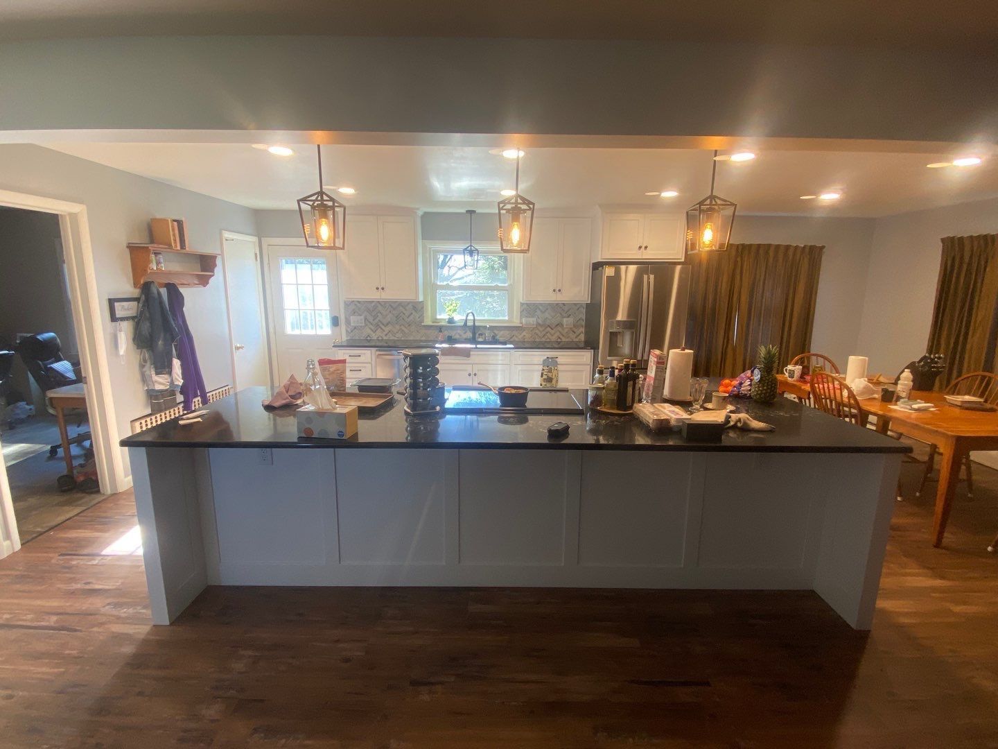 a kitchen with a large island in the middle of the room