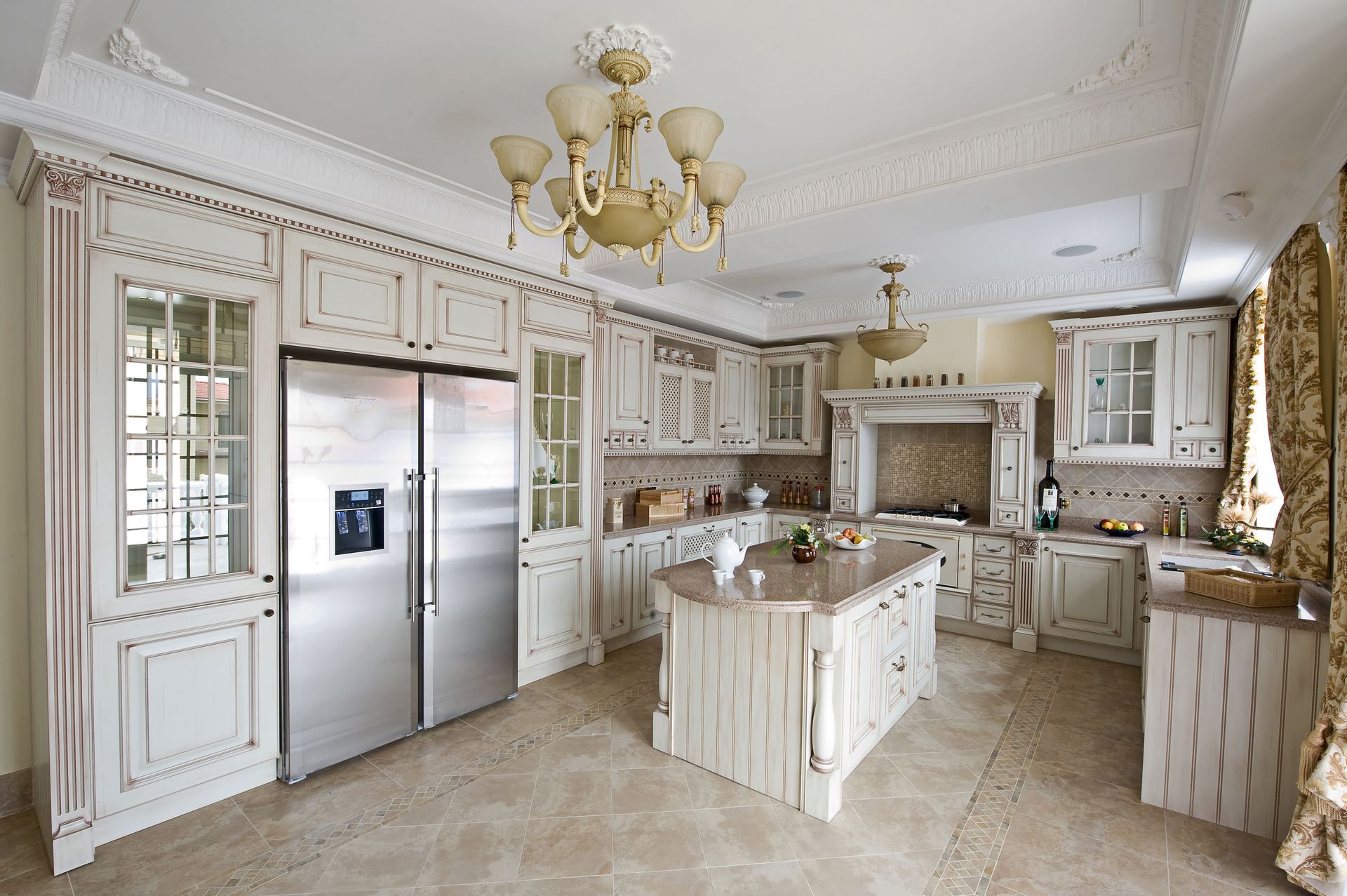 a large kitchen with white cabinets and stainless steel appliances