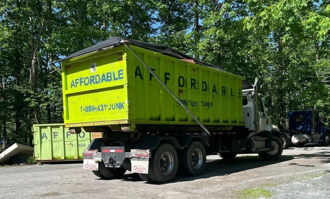 Lime green dumpster labeled 