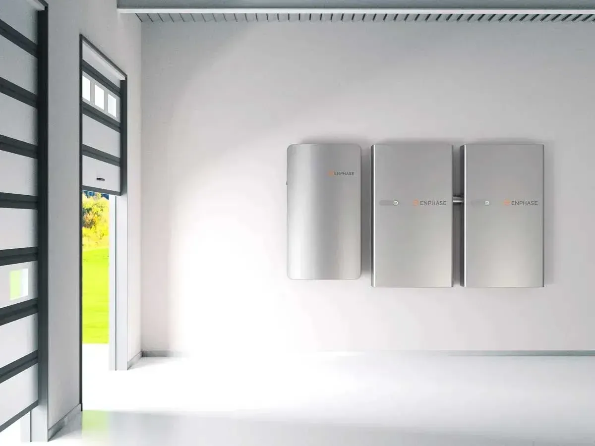 Bright modern room with three wall-mounted white cabinets beside an open doorway.