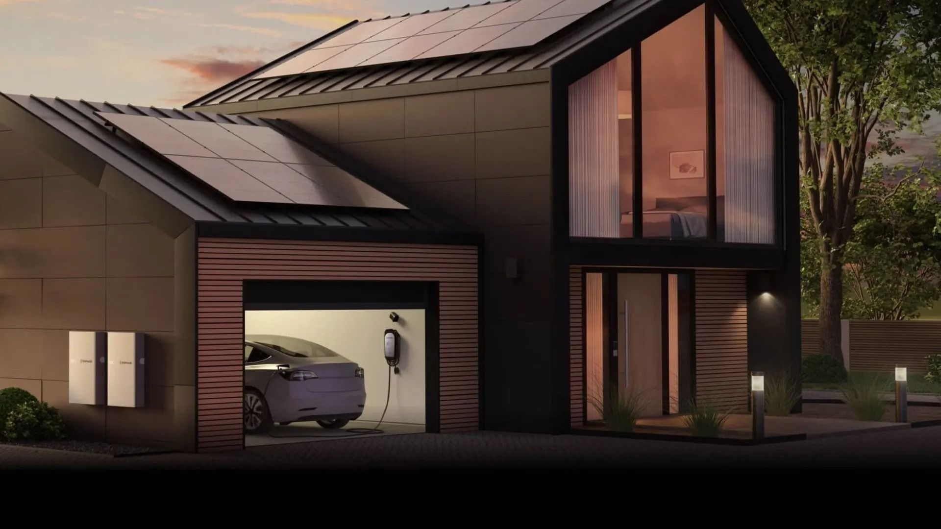 House roof covered with blue solar panels beside tree branches