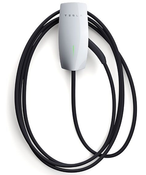 White Tesla wall connector with a coiled black charging cable on a white background