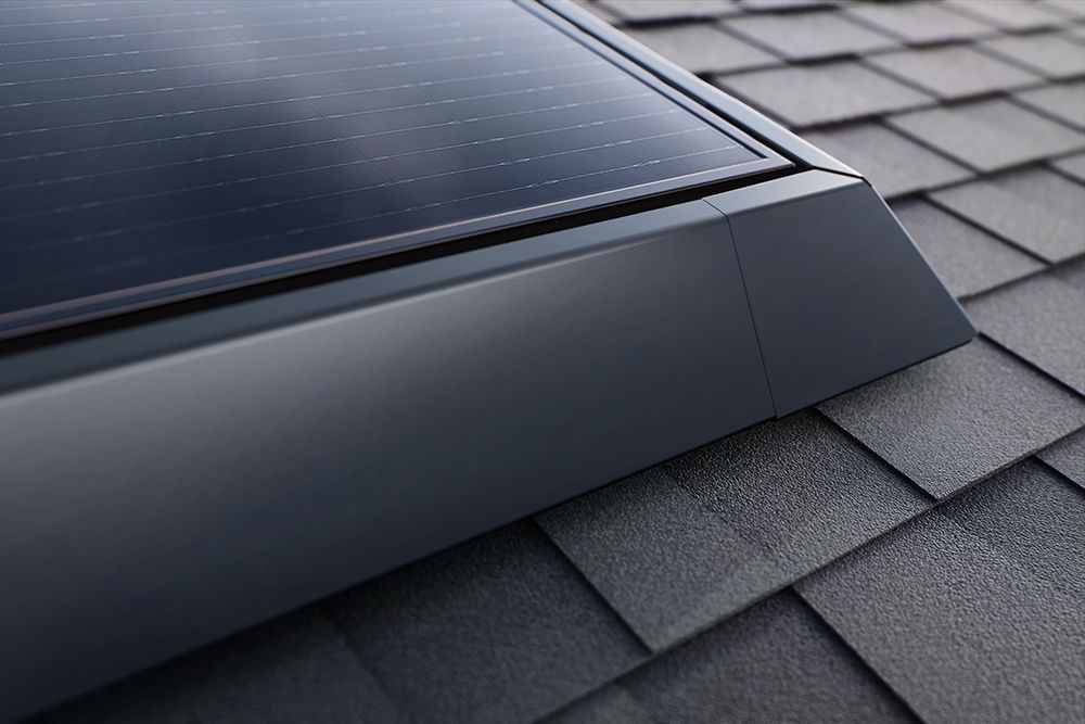 Solar panel mounted on a gray shingled roof