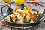 seafood dish with rice, shrimp and mussels