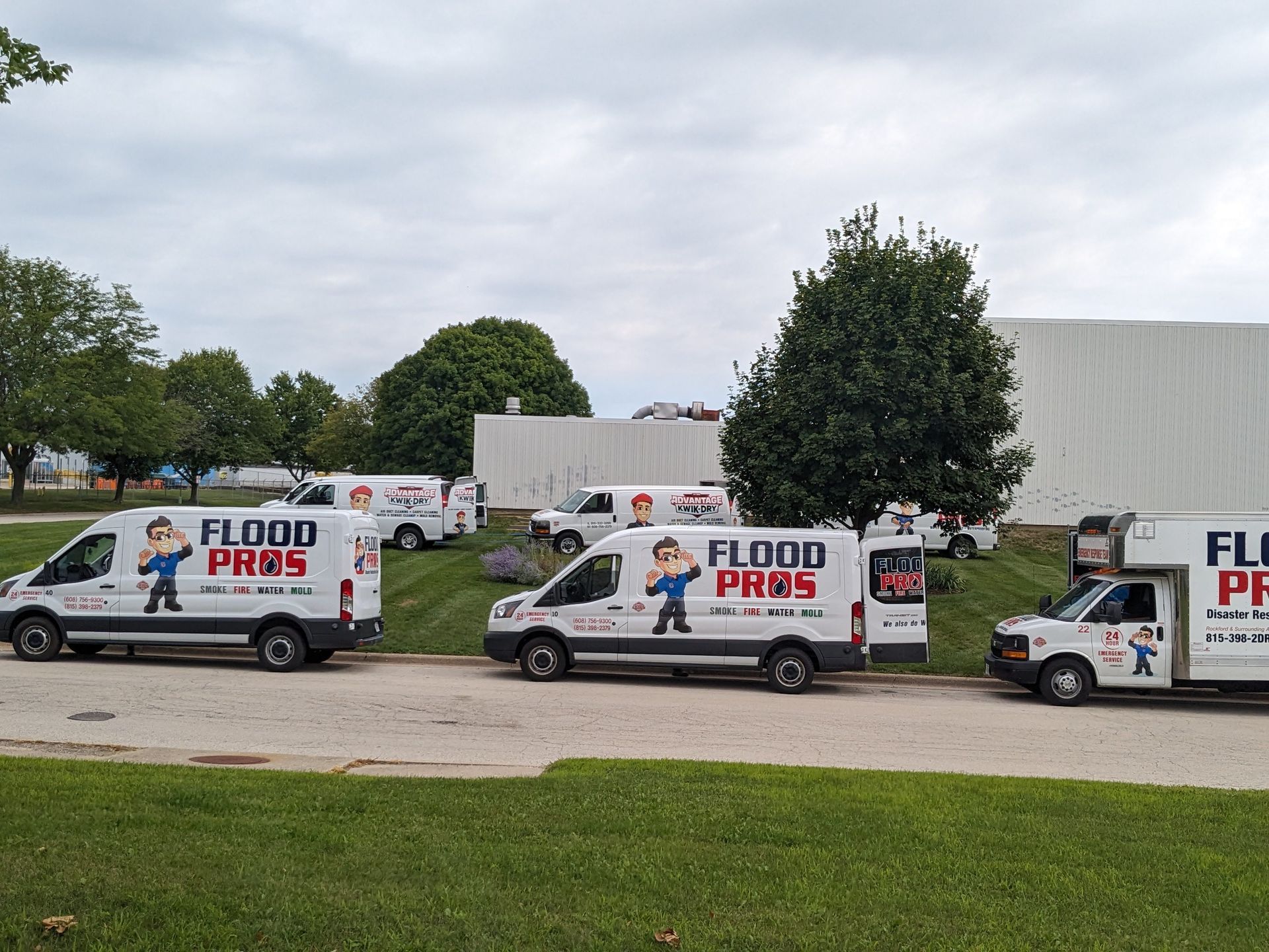 Several white vans with 