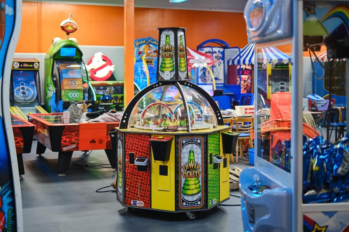 a bunch of arcade games are lined up in a room