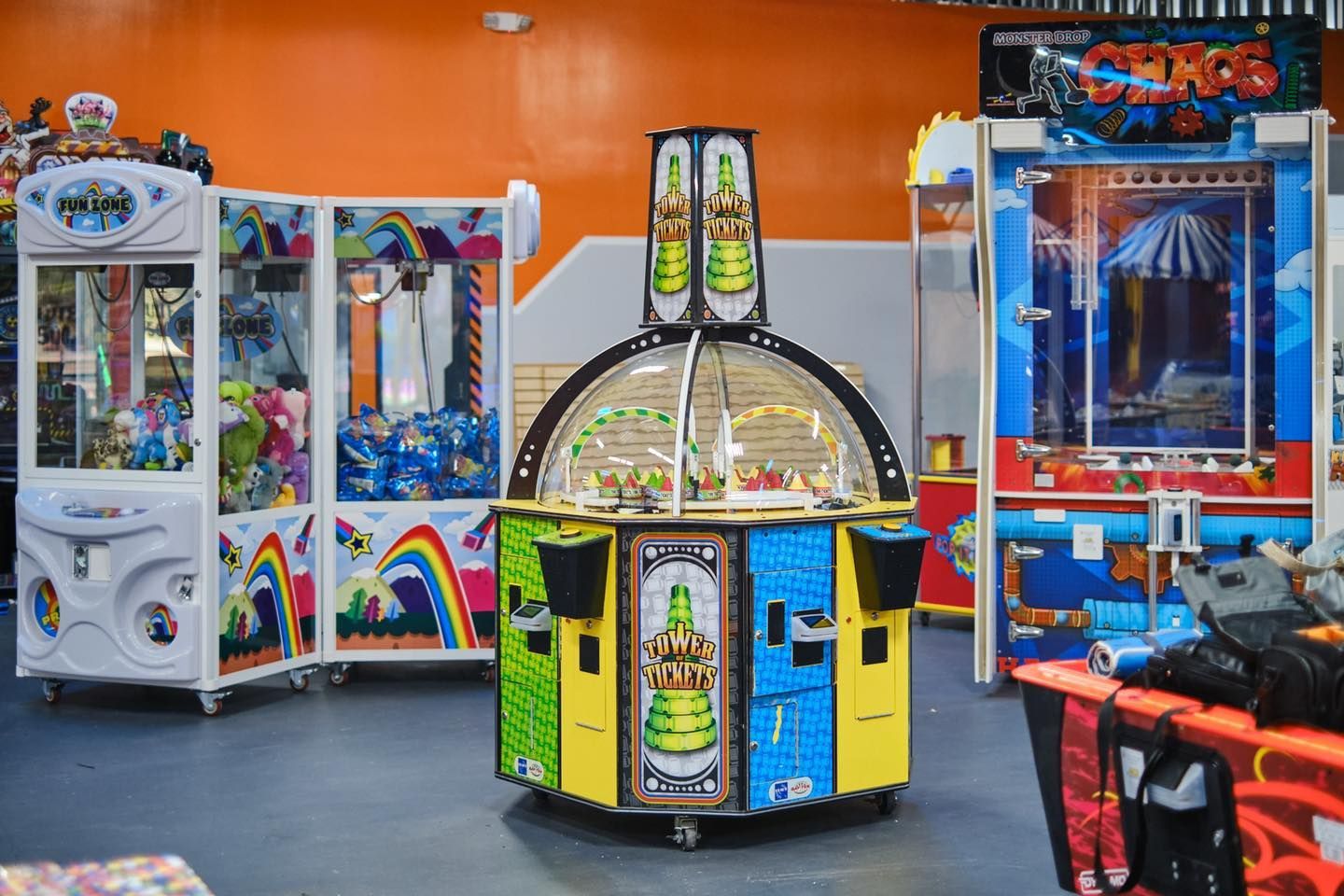 a bunch of arcade games are lined up in a room