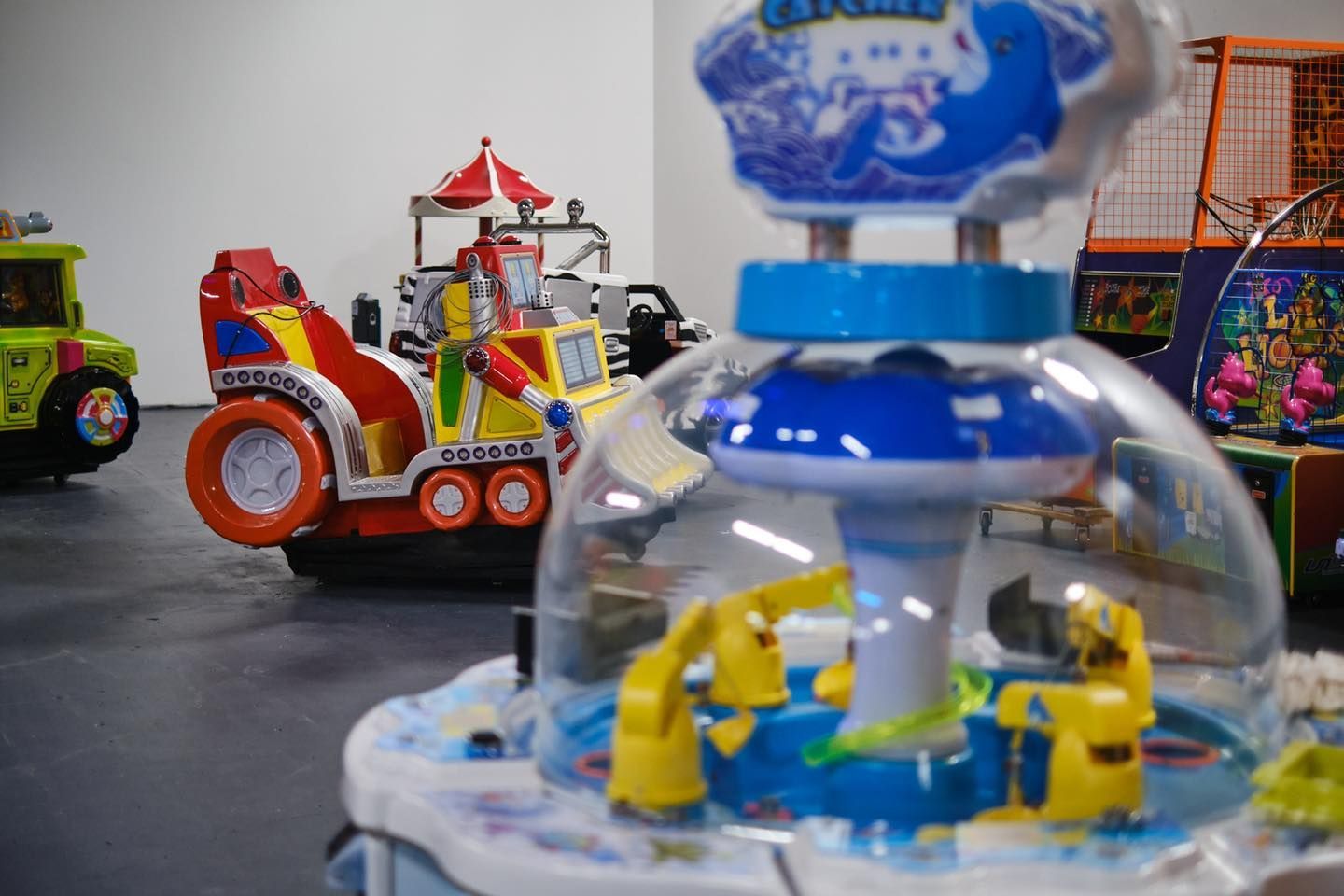 a bunch of toys are sitting on the floor in a room