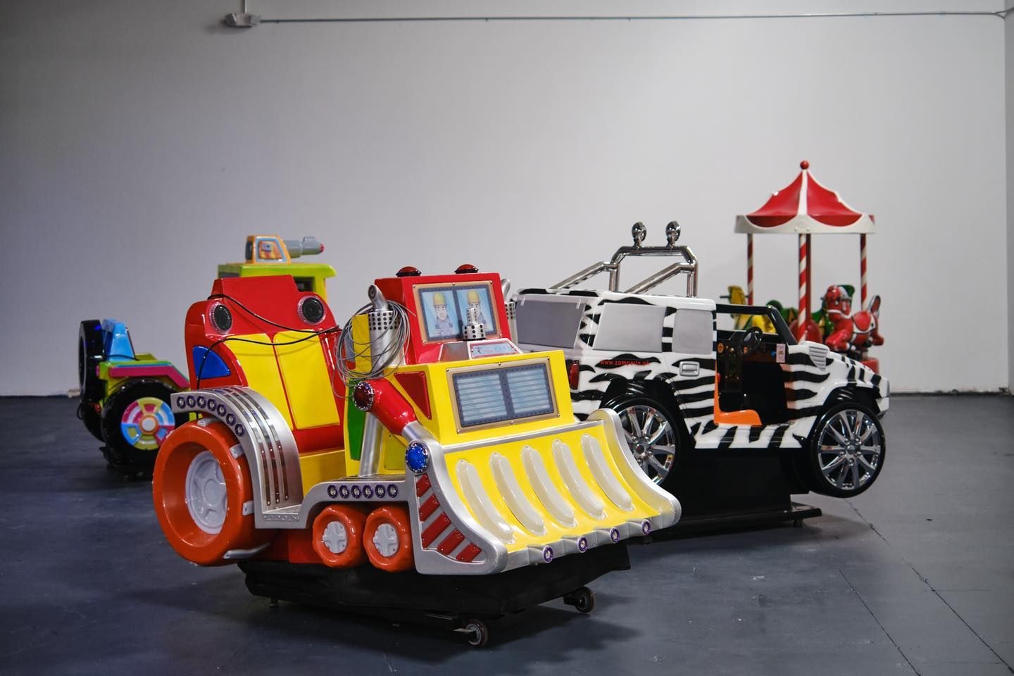 a group of colorful toy cars are sitting in a room