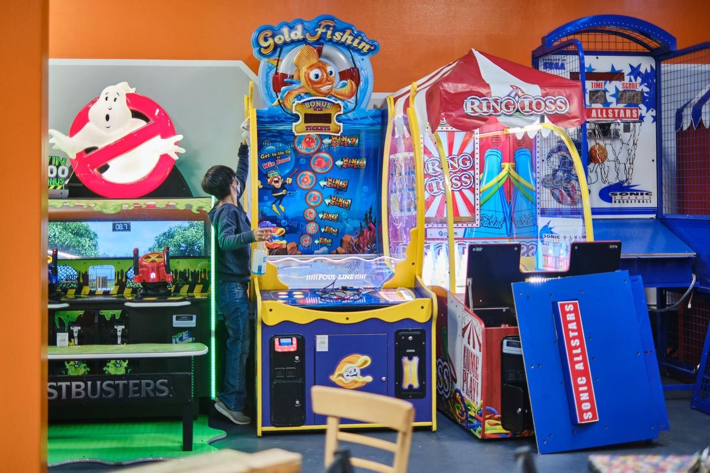a man is playing a game in an amusement park