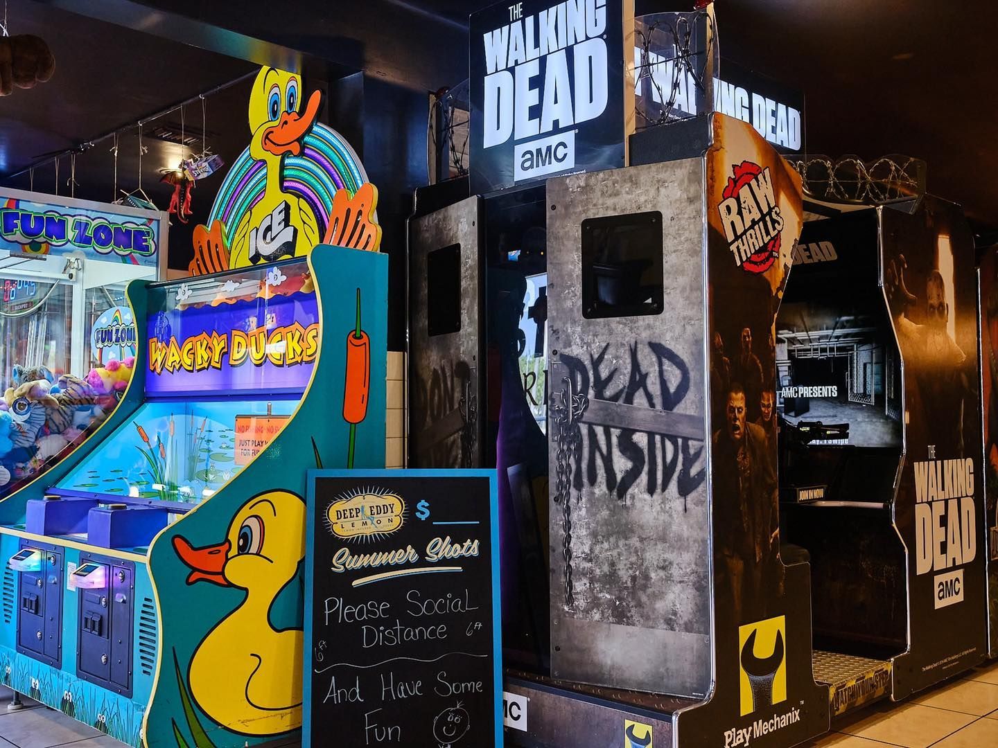 a bunch of arcade games are lined up in a room