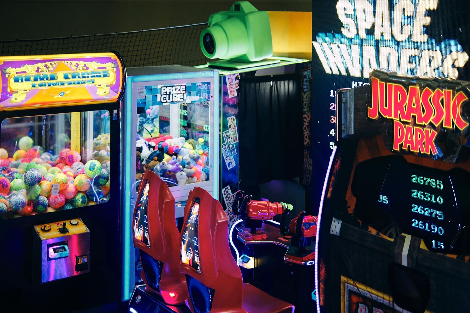 a collage of arcade games including Space Invaders and Jurassic Park