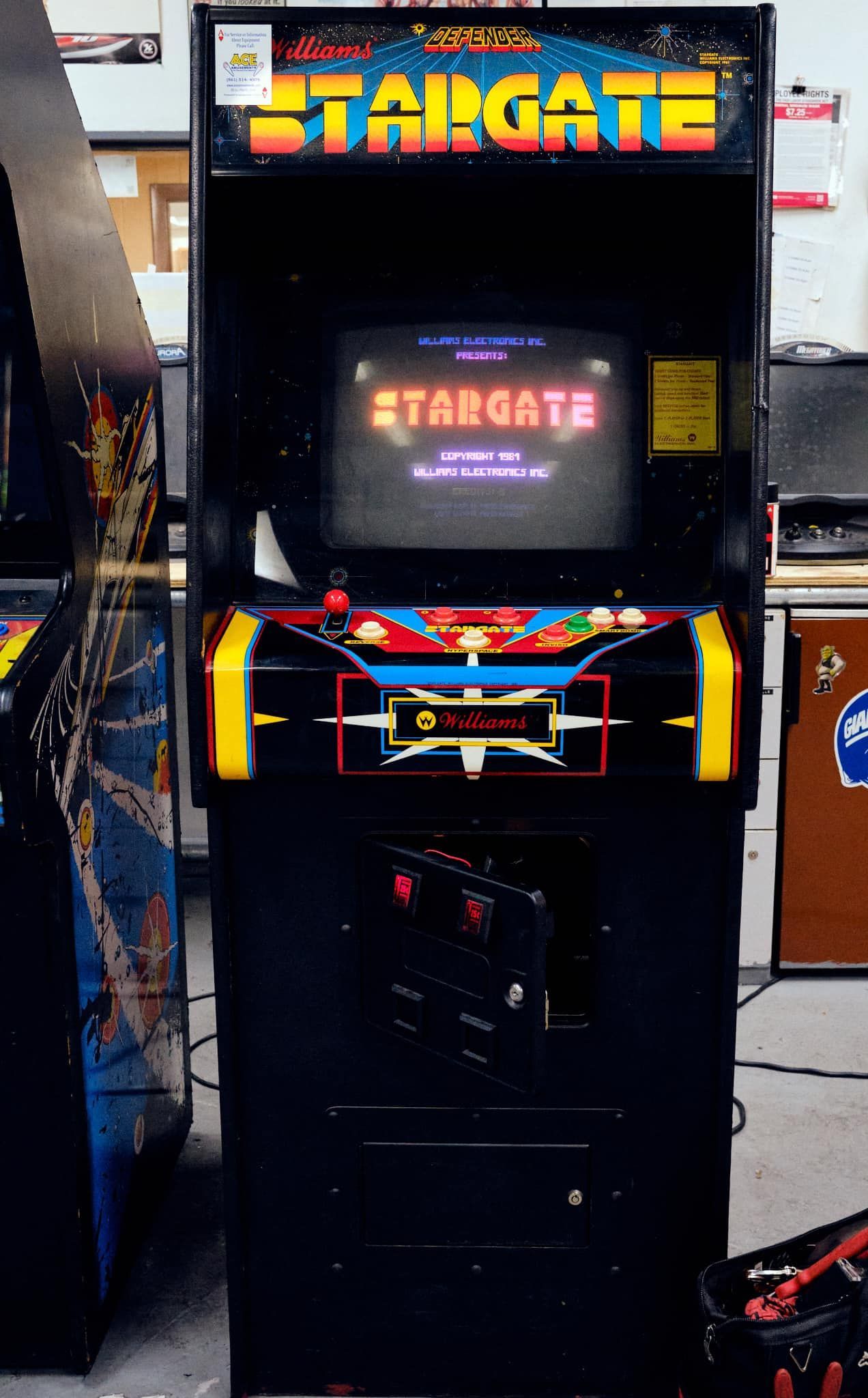 a stargate arcade game is sitting on the floor