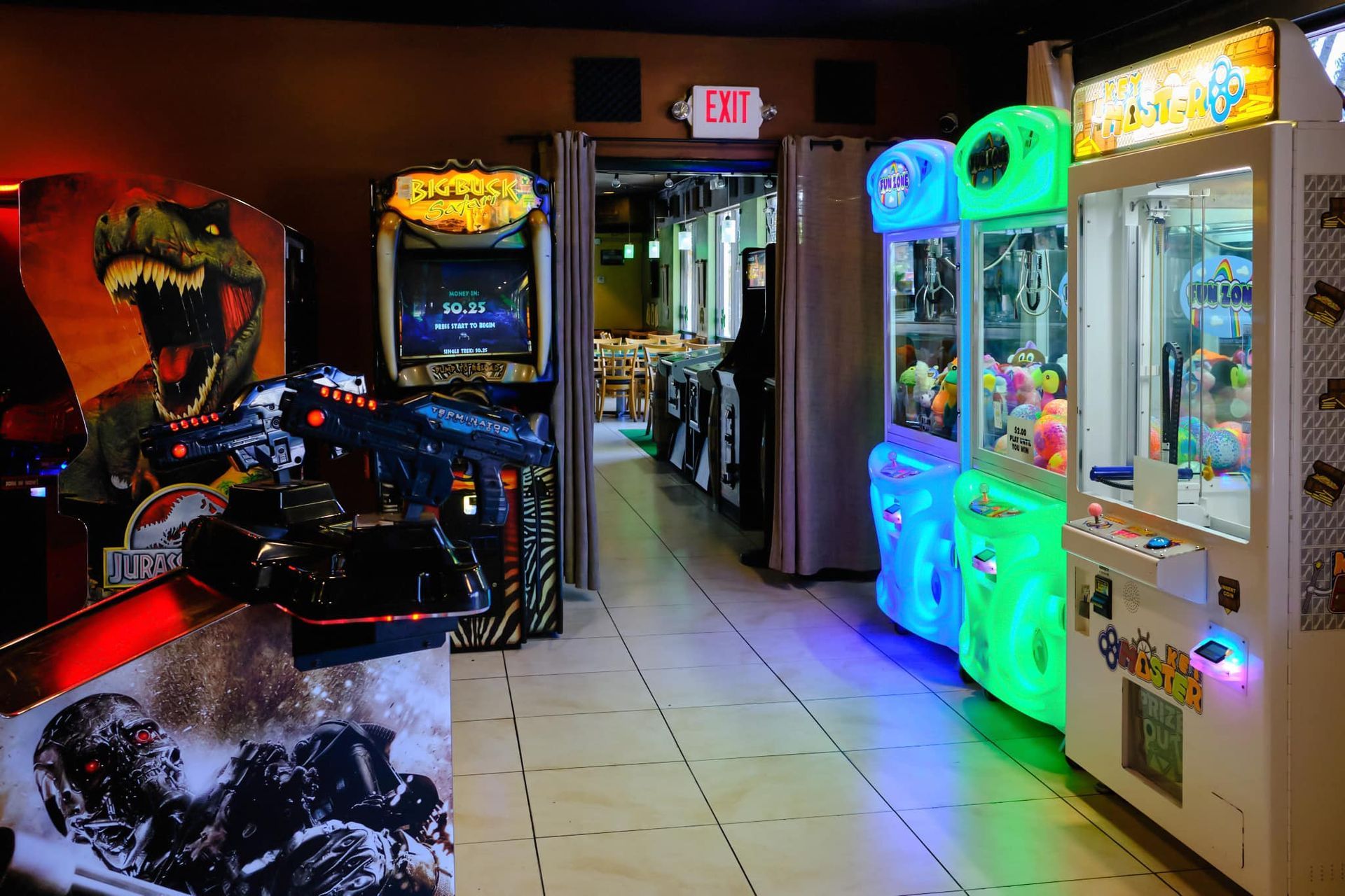 a bunch of arcade games are lined up in a hallway