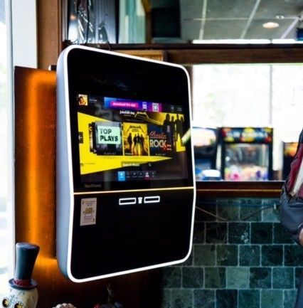 a pool table with a picture of Elvis Presley on the wall