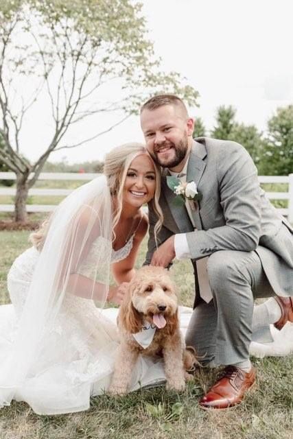 Wedding couple with their dog