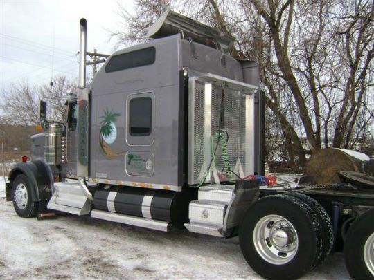 a semi truck parked in the snow