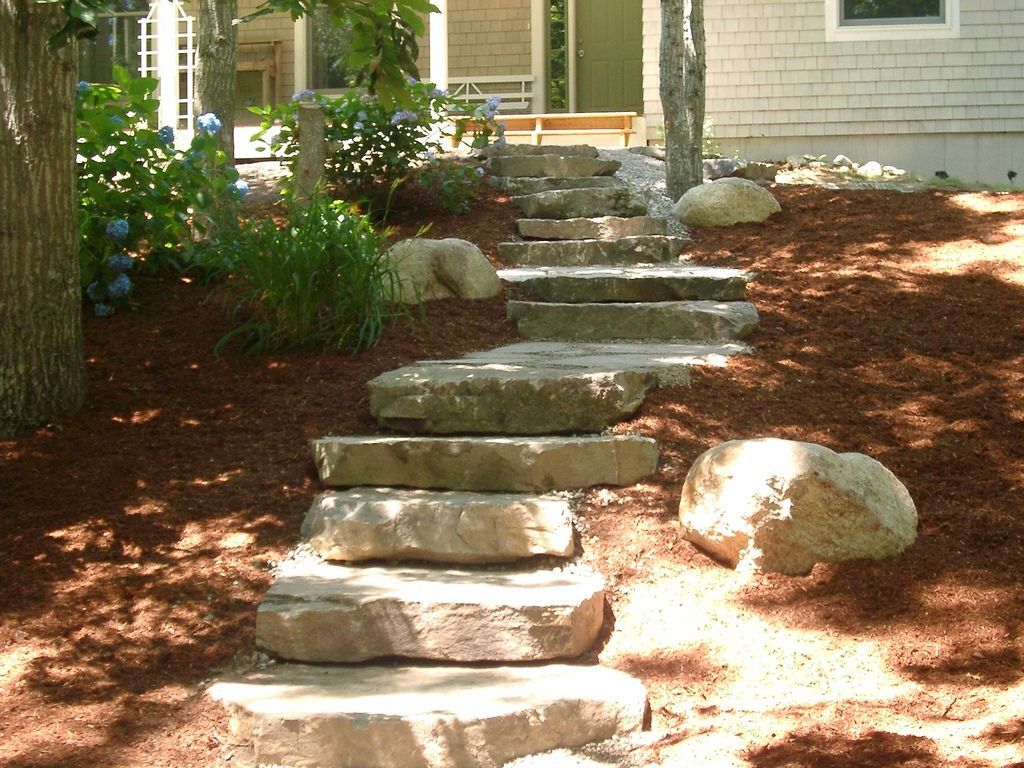 A set of stone steps leading up to a house