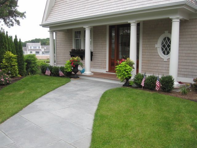 A house with a walkway leading to the front door