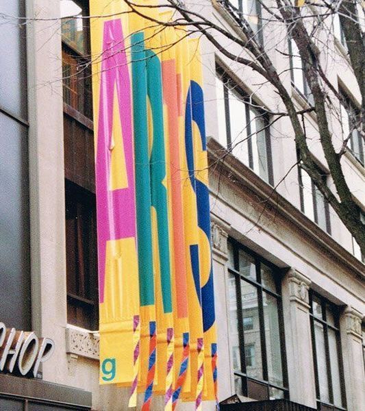 Yellow banners with colorful letters spelling