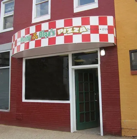 Red brick building with checkered awning: 