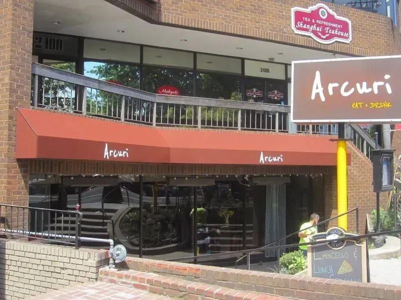 Restaurant entrance with red awning, 