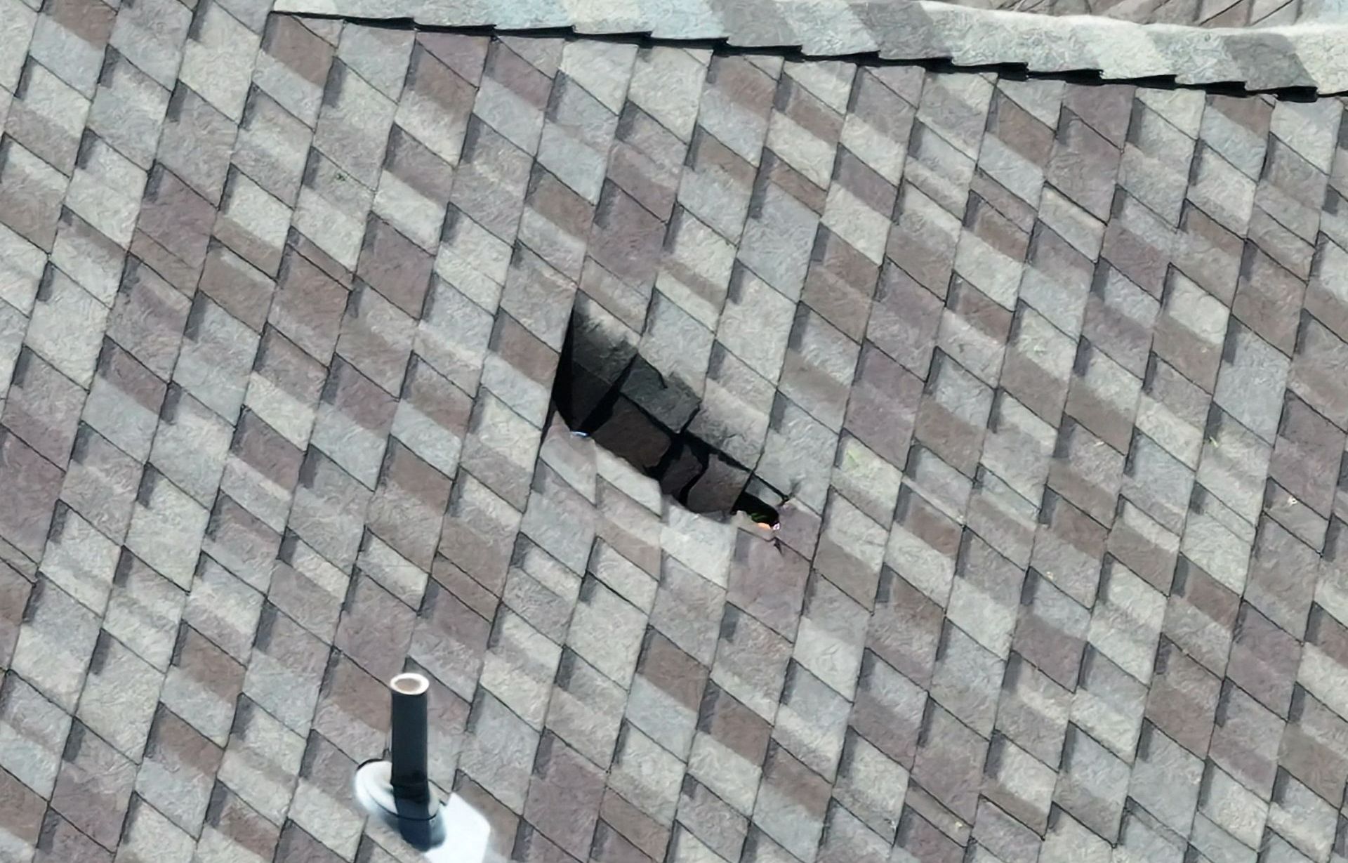 Wind damaged shingles on a home in the DFW metroplex, needed roofing material replaced.