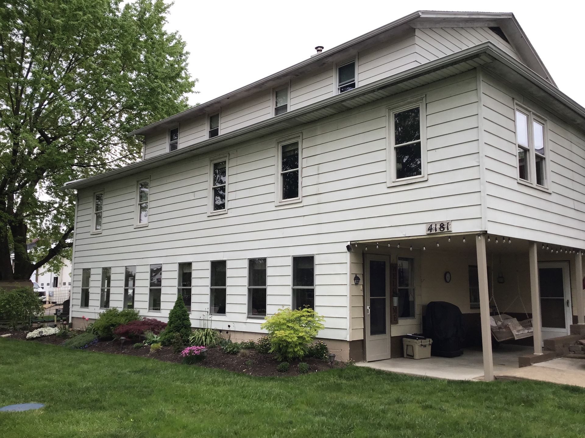 White siding house with windows