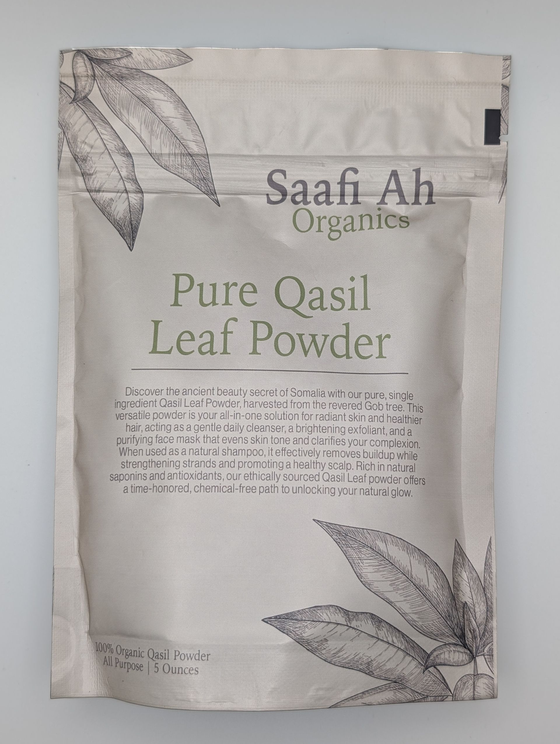 A beige stand-up pouch labeled Saafi Ah Organics Pure Qasil Leaf Powder, decorated with botanical leaf illustrations.
