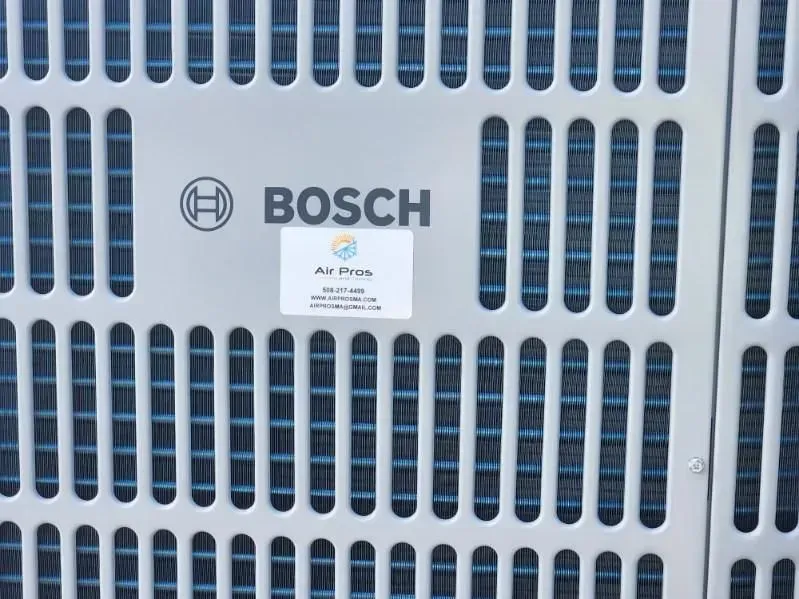 Close-up of a white Bosch air conditioner unit with a branded sticker.