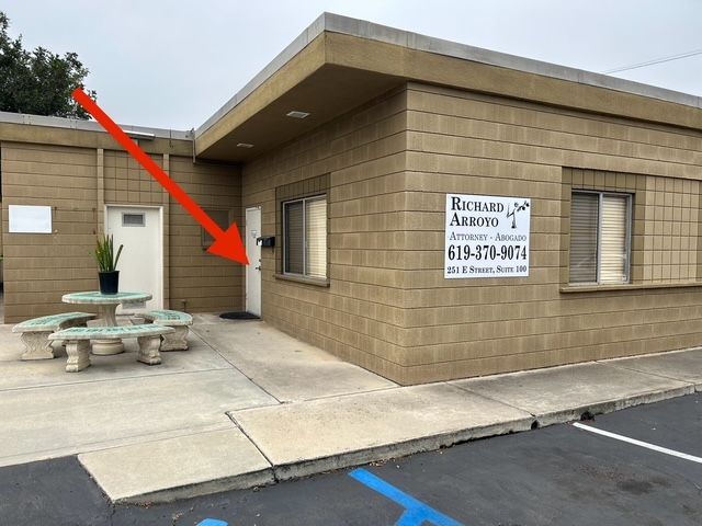 A building with a sign and a door