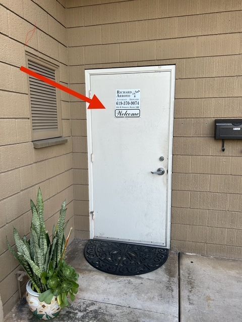 A white door with a sign on it