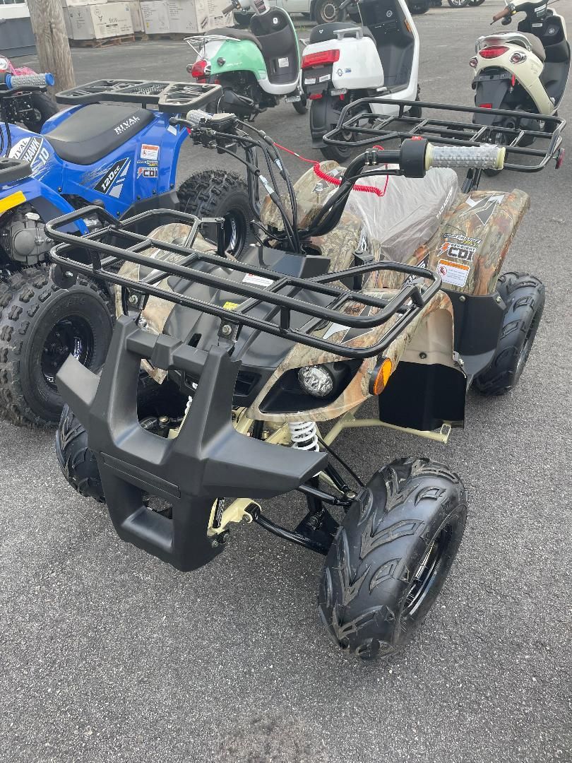 A group of atvs are parked in a parking lot.