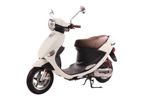 A white scooter is parked on a white surface.
