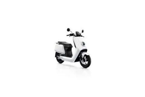 A white scooter is parked on a white surface.