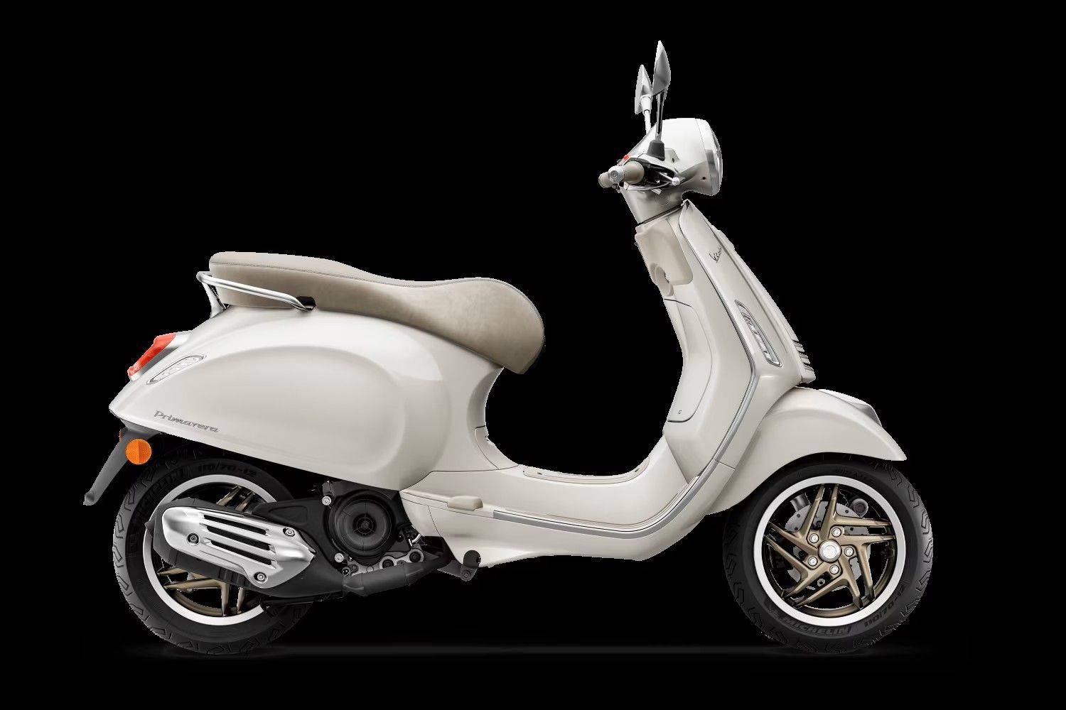 Cream-colored vintage scooter in side view on a black background.